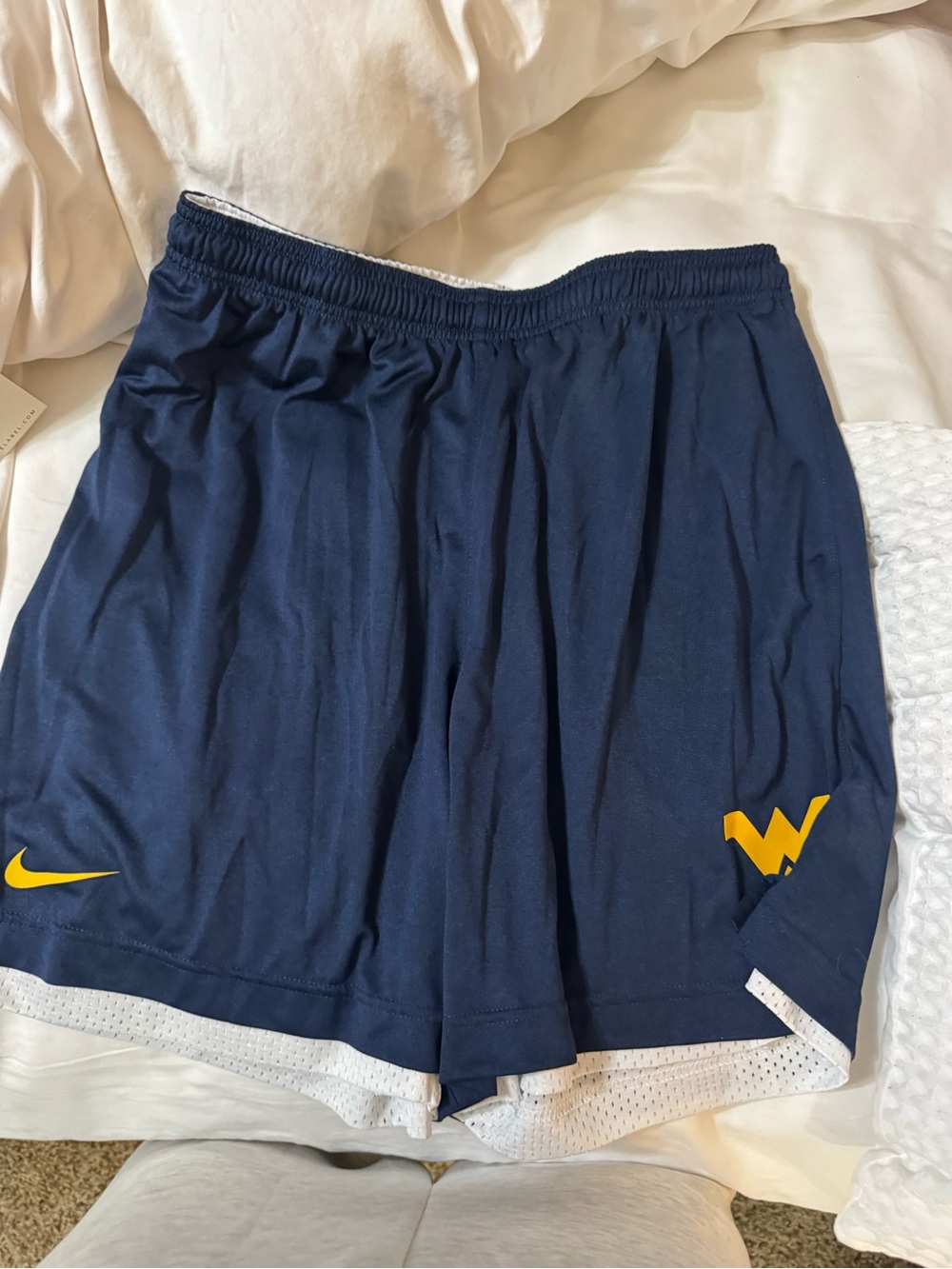 Nike men’s WVU reversible Navy Blue Athletic Shorts with Yellow Logo